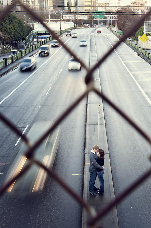 bride and groom hugging in the middle of freeway - wedding photo by top Portland, Oregon wedding photographer Aaron Courter